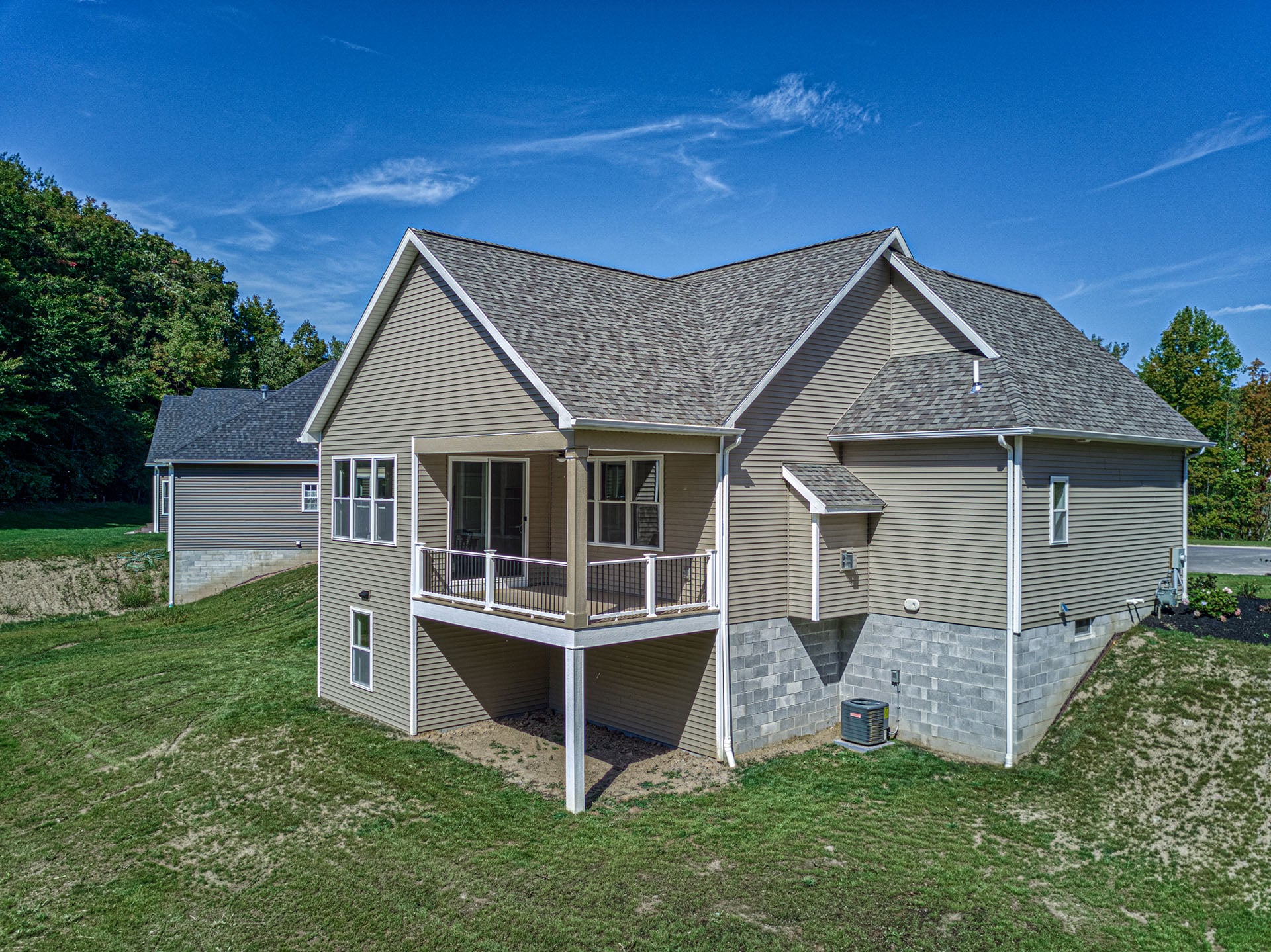 Gerber home with a walk-out lower level set into a sloping lot