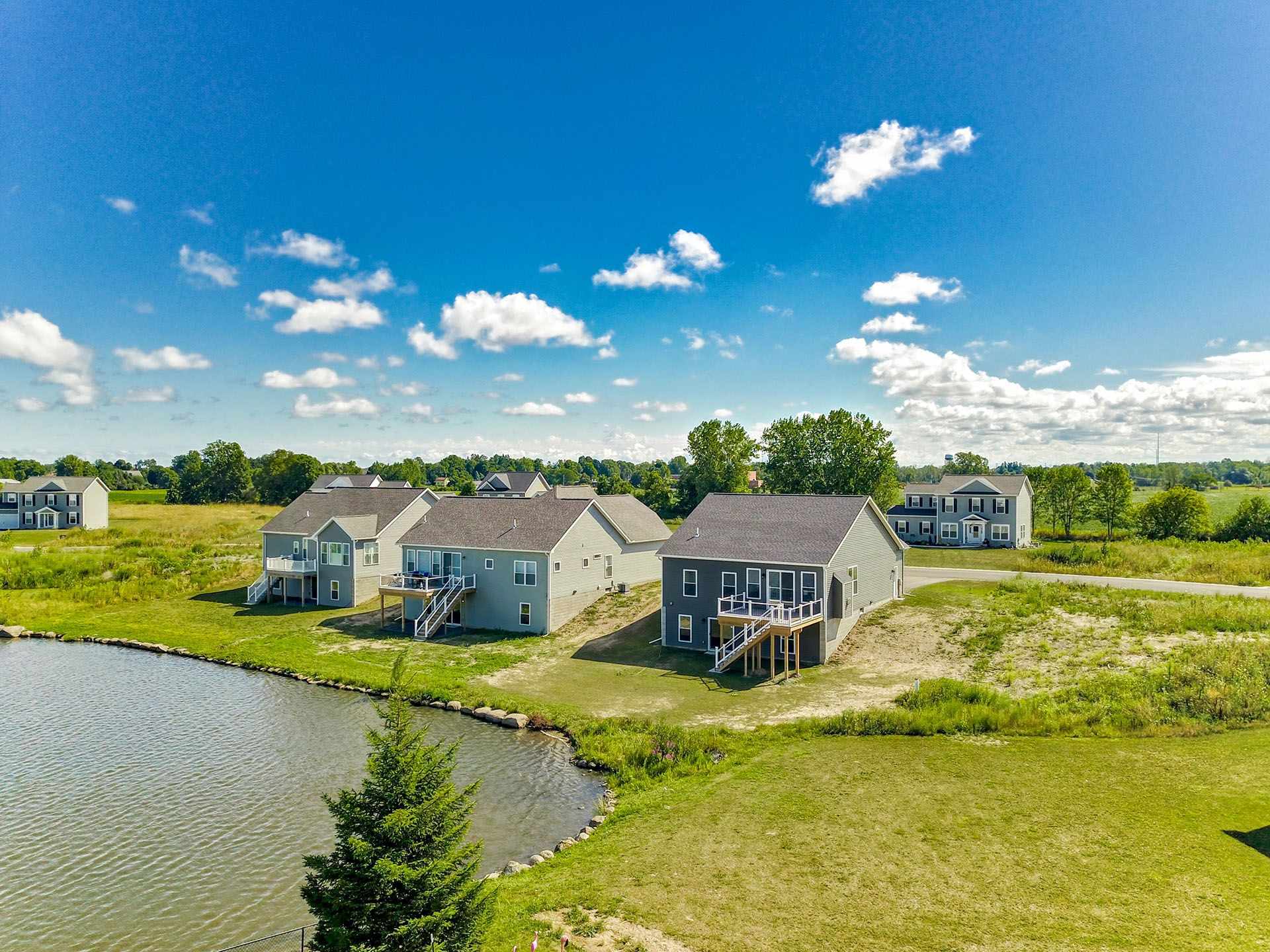Aerial of a finished Gerber home and its lot on a clear day